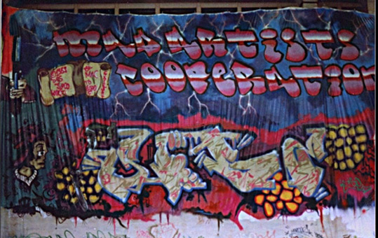 95qm Leinwand 1989. Ein Graffiti Projekt für Hans Böhrs Veranstalter Faschingsfest LiLaBe in der Fachhochschule Bergedorf/Hamburg. Projektausführung von der Mad Artists Cooperation, Zico/Siko Ortner und seinem Graffitischüler Wizz. Außerdem beteiligt waren Sis/Sige und Bibase/Base. Rechte fertige Seite vom 95qm Leinwandgraffiti 1989.